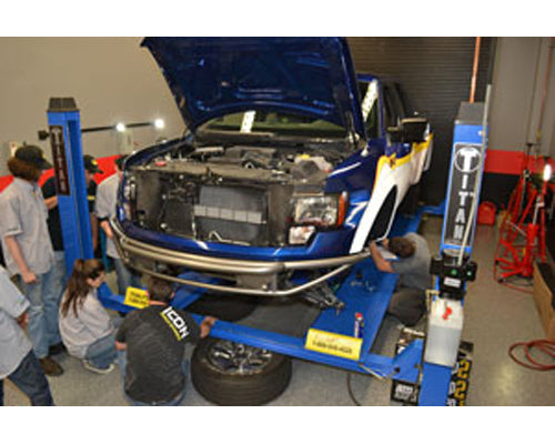 MANUFACTURERS AND STUDENTS CUSTOMIZE WD-40/SEMA CARES FOOSE F-150 AT SEMA GARAGE